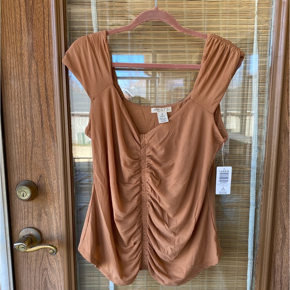 Torrid Festi line tan ruched mesh top.